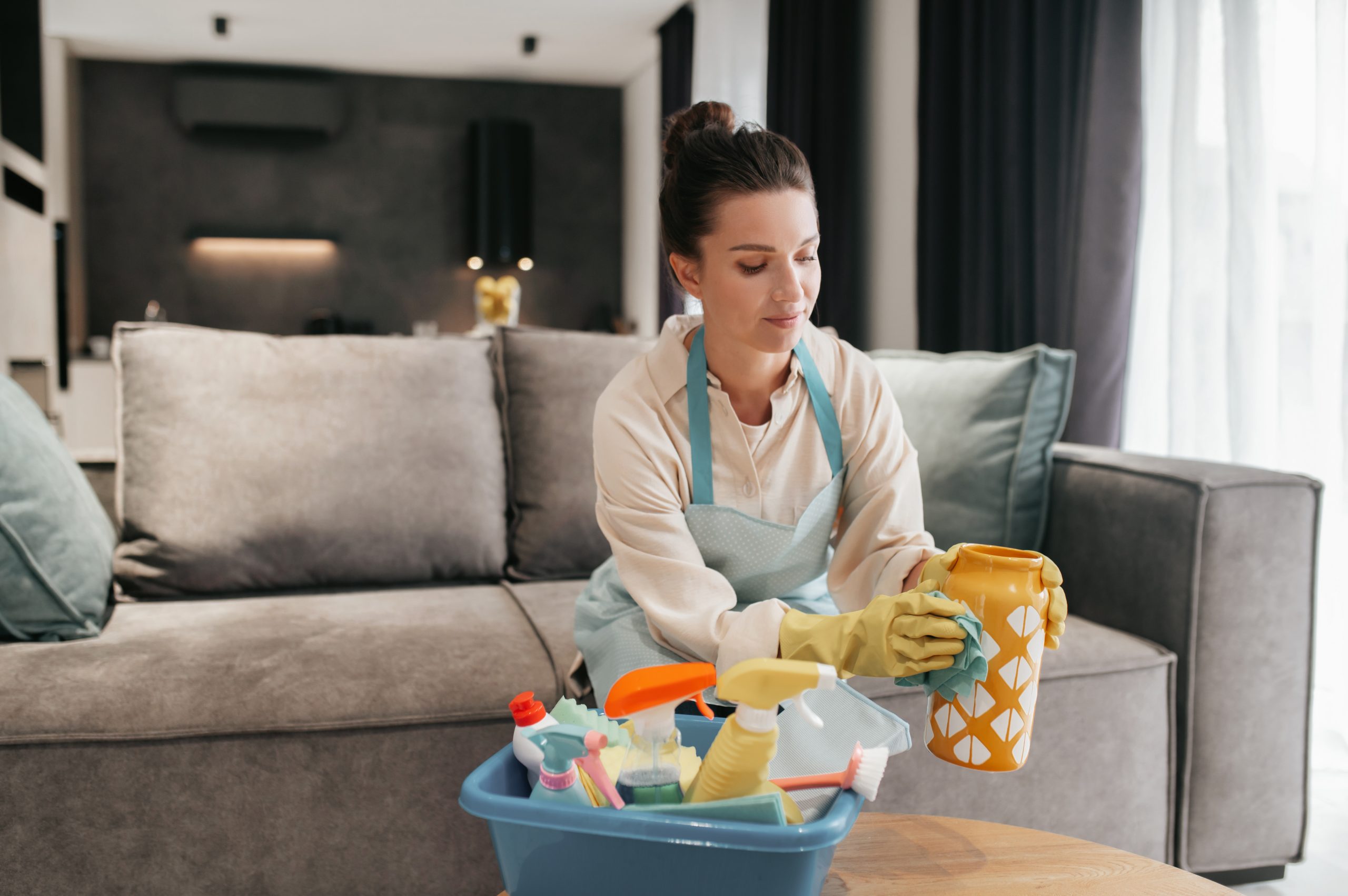 Young woman doing housework and looking busy